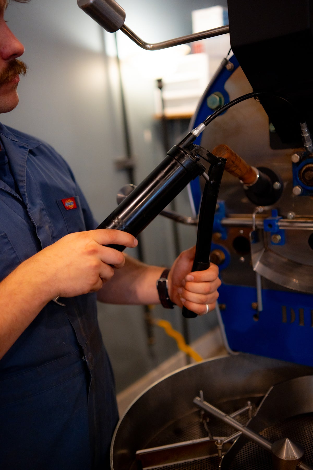 Coffee technician servicing a speciality coffee roaster